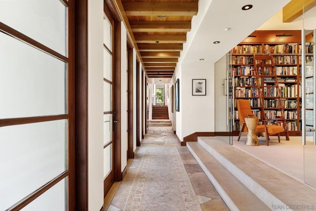 corridor featuring beam ceiling