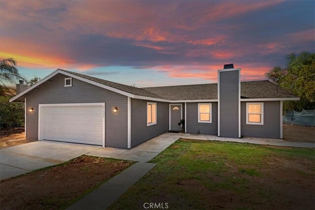 ranch-style home with a garage