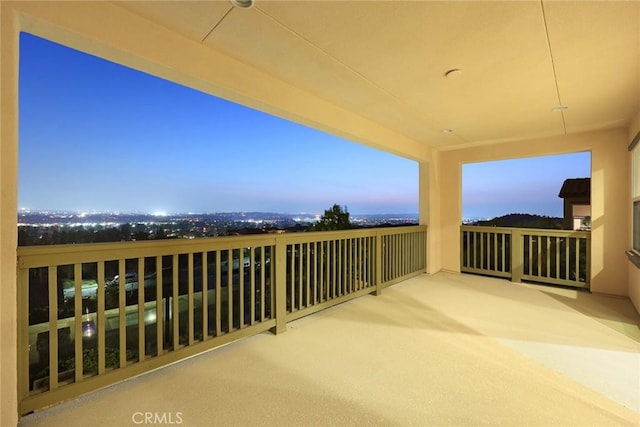 view of balcony at dusk