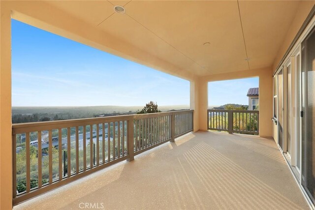 balcony featuring ceiling fan