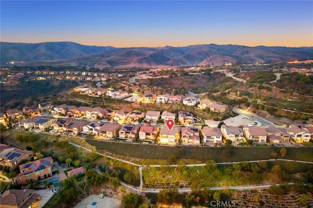 2598 E Temblor Ranch Dr, Brea, CA 92821 - aerial view at dusk of a residential view and a mountain view