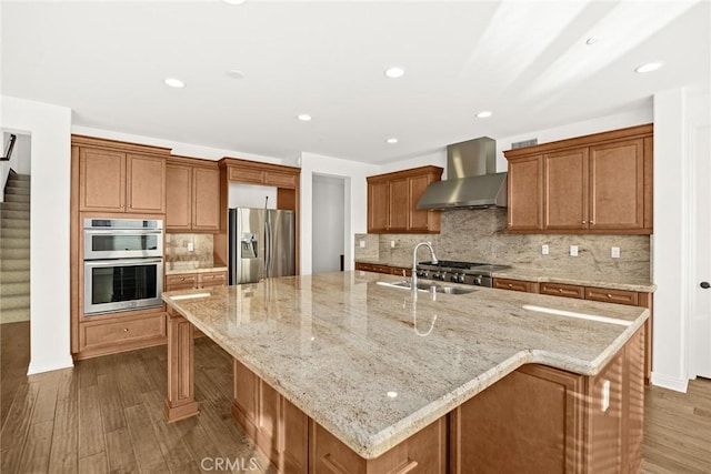 2598 E Temblor Ranch Dr, Brea, CA 92821 - kitchen with wall chimney exhaust hood, stainless steel appliances, a sink, dark wood-type flooring, and a spacious island