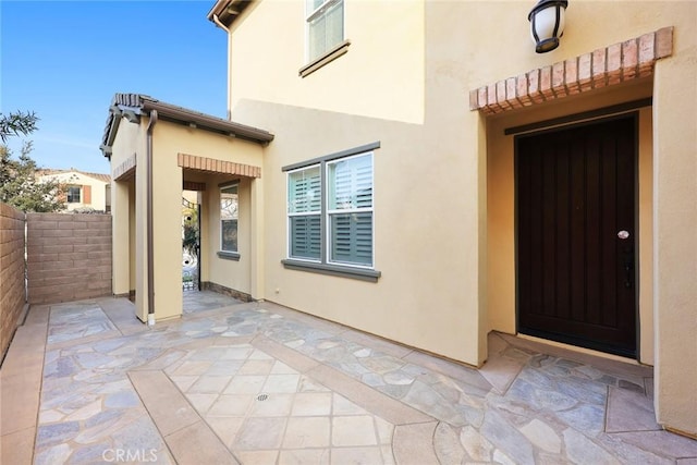 doorway to property featuring a patio