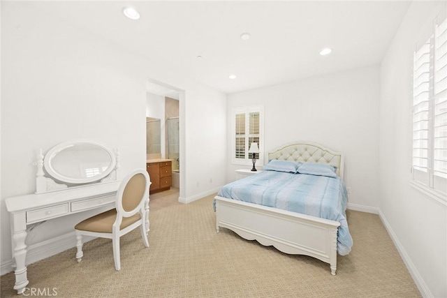 2598 E Temblor Ranch Dr, Brea, CA 92821 - bedroom with multiple windows, light colored carpet, recessed lighting, baseboards, and connected bathroom