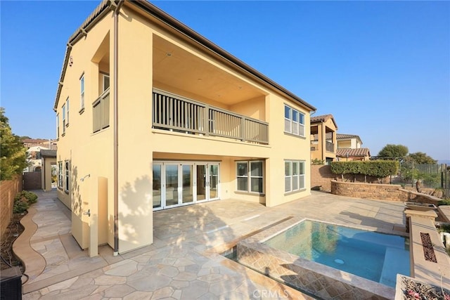 2598 E Temblor Ranch Dr, Brea, CA 92821 - back of house featuring a balcony, stucco siding, a fenced backyard, and a patio