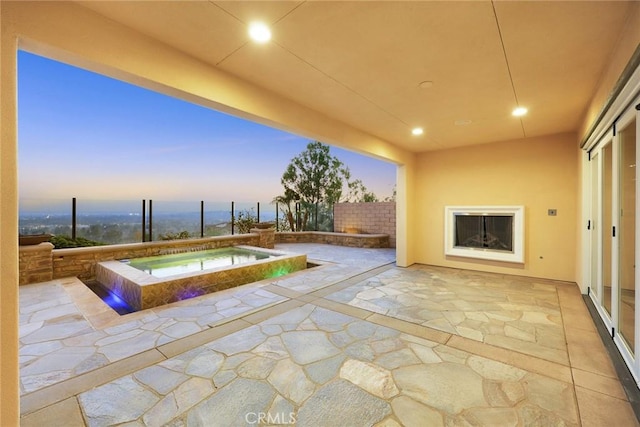 2598 E Temblor Ranch Dr, Brea, CA 92821 - pool at dusk with a patio area and an in-ground hot tub