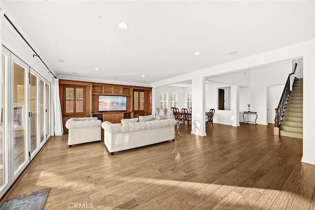 2598 E Temblor Ranch Dr, Brea, CA 92821 - living room featuring wood finished floors, stairway, and recessed lighting