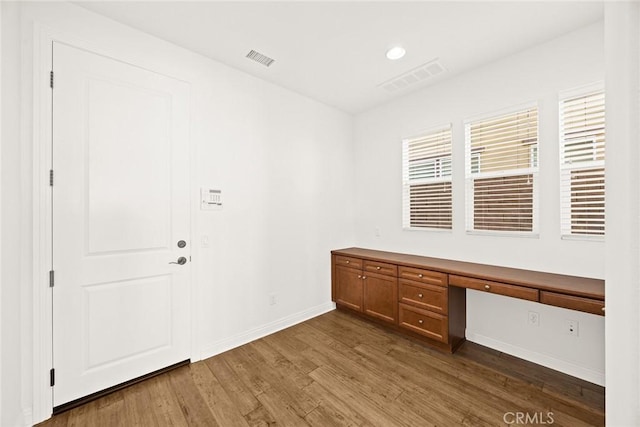 2598 E Temblor Ranch Dr, Brea, CA 92821 - unfurnished office with built in desk, dark wood-type flooring, and baseboards