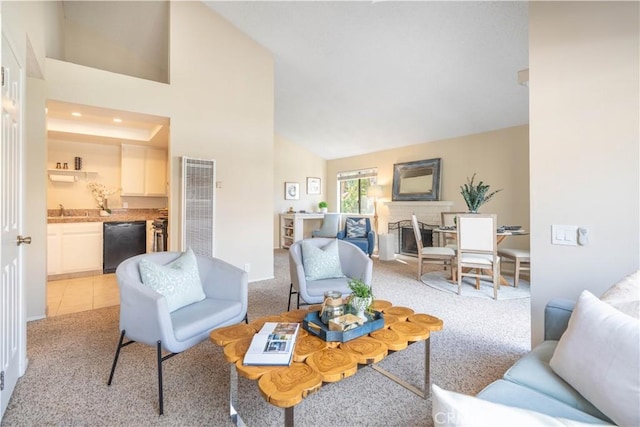 living room featuring sink, high vaulted ceiling, and light carpet