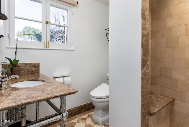 bathroom with toilet and sink