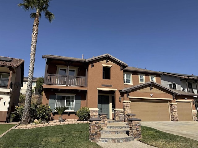 view of front of home featuring a garage, a front yard, and a balcony