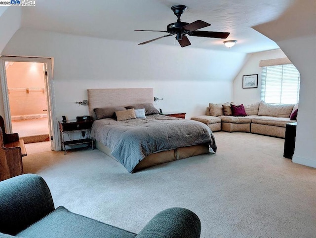 bedroom with lofted ceiling, light carpet, and ceiling fan