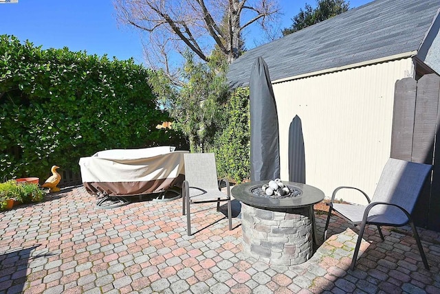 view of patio / terrace with an outdoor fire pit