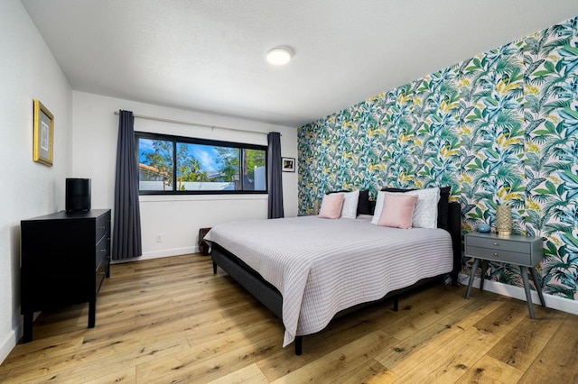 bedroom with light wood-type flooring