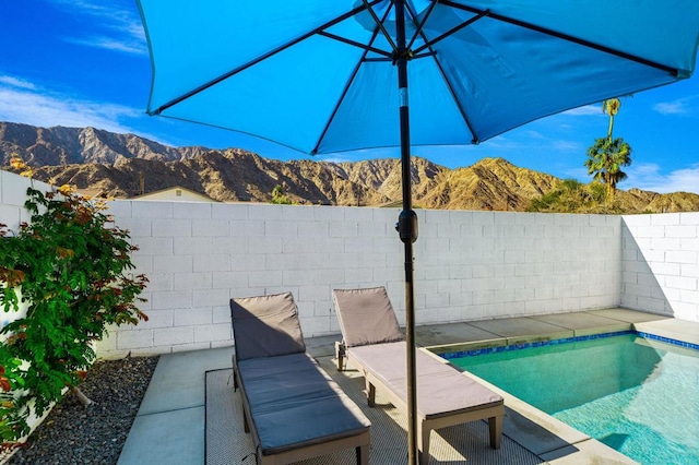 view of swimming pool featuring a mountain view