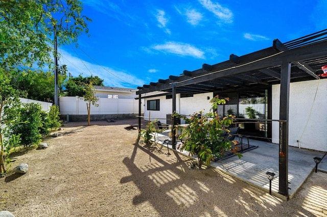 view of yard featuring a pergola and a patio