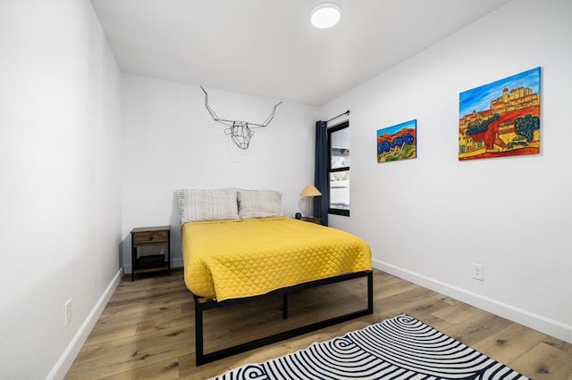 bedroom with wood-type flooring