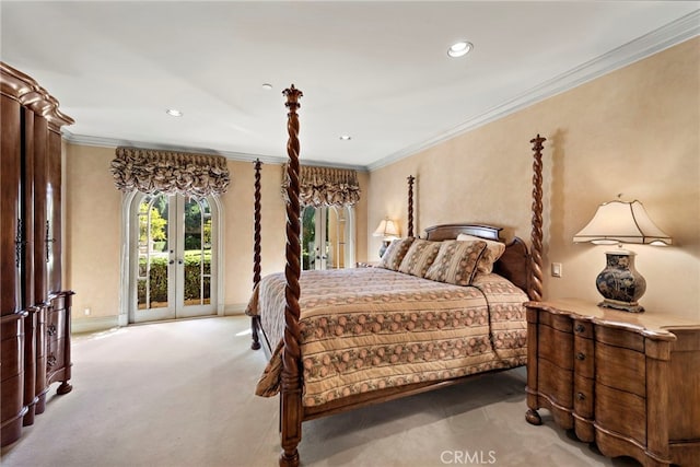 bedroom with carpet floors, ornamental molding, access to outside, and french doors