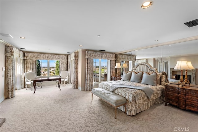 bedroom featuring multiple windows, crown molding, and light colored carpet