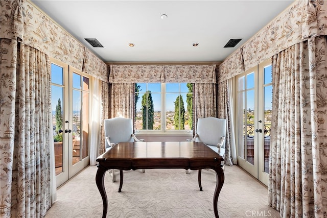 carpeted office with french doors, a healthy amount of sunlight, and crown molding