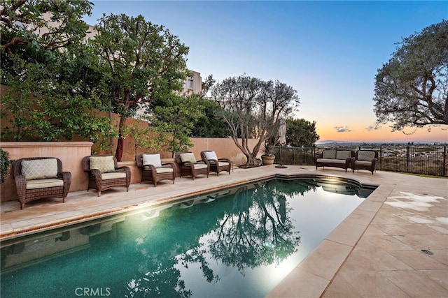 view of pool featuring a patio area, a fenced backyard, a fenced in pool, and outdoor lounge area