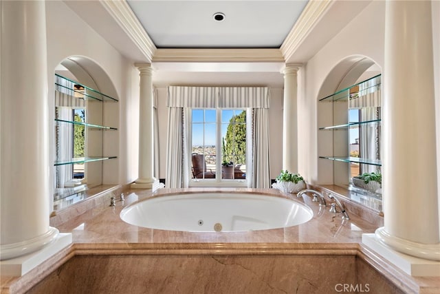 bathroom with a relaxing tiled tub and ornate columns