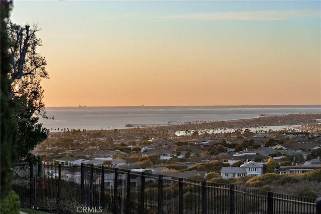 view of water feature with fence and a residential view