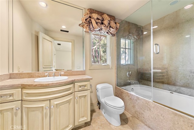 full bath featuring recessed lighting, tile patterned floors, toilet, vanity, and bath / shower combo with glass door