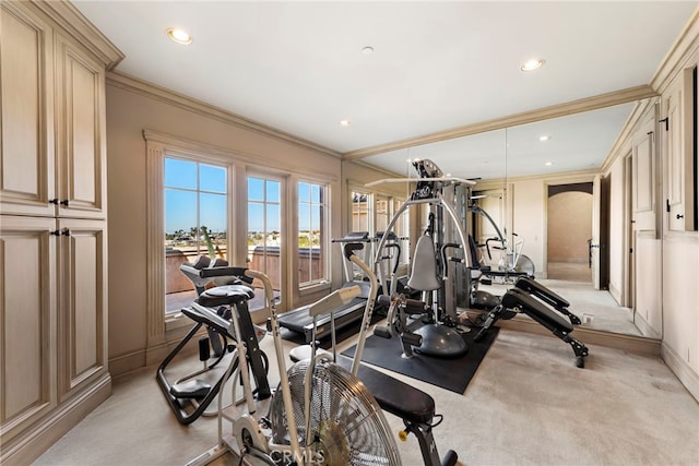 workout room with light colored carpet, arched walkways, ornamental molding, and recessed lighting