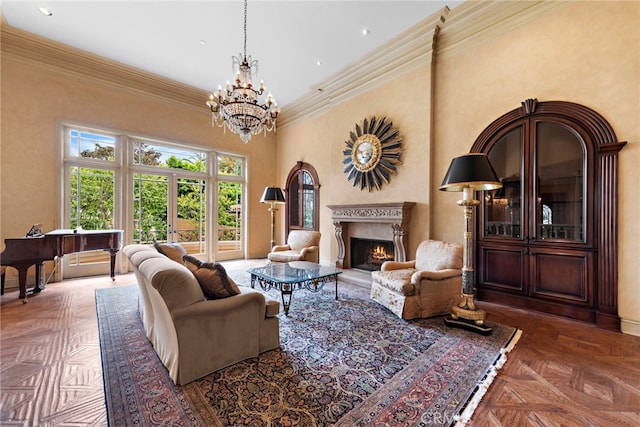 living room with recessed lighting, a high end fireplace, ornamental molding, baseboards, and a notable chandelier