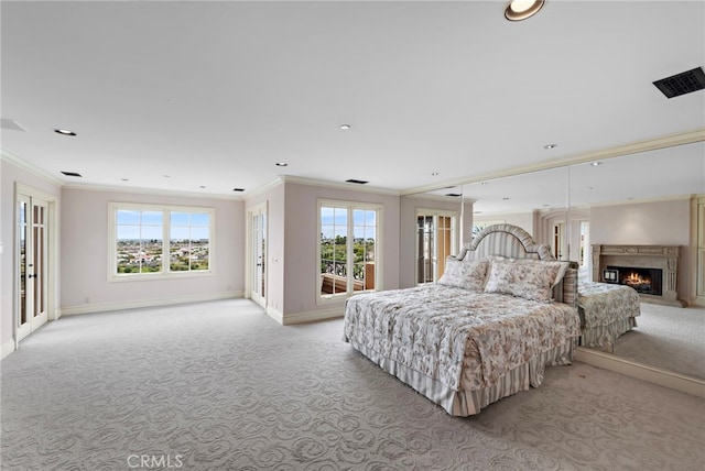 bedroom with light carpet, ornamental molding, multiple windows, and baseboards