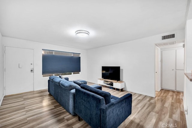 living room with light hardwood / wood-style floors