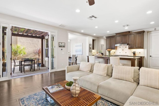 living room featuring dark hardwood / wood-style flooring