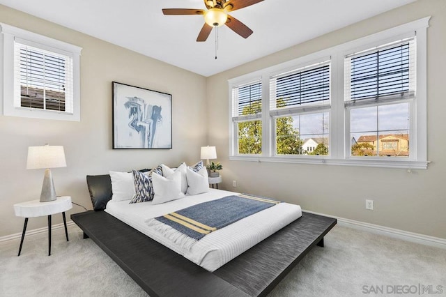 carpeted bedroom featuring ceiling fan