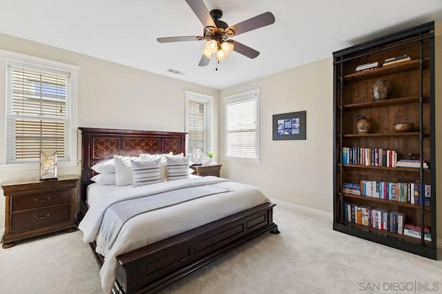 carpeted bedroom with ceiling fan