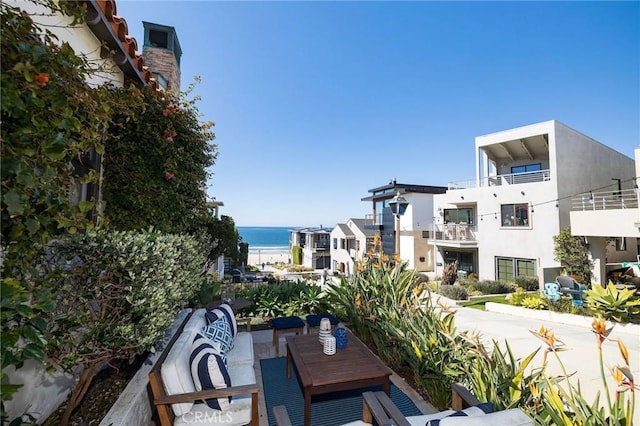 balcony featuring a patio and a water view