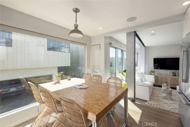 dining space featuring wood-type flooring