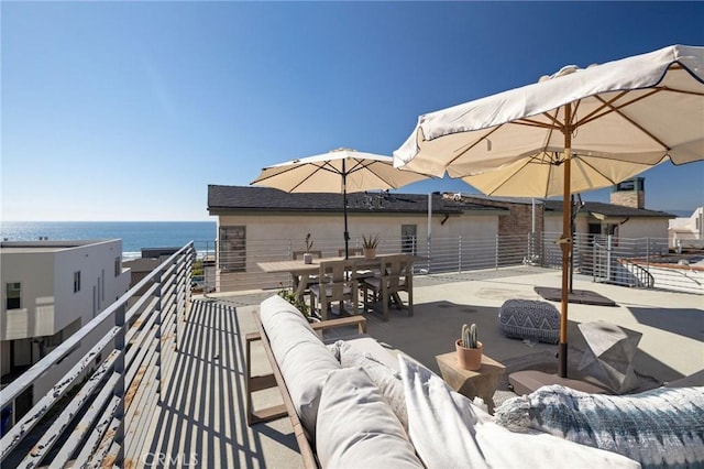 view of patio featuring outdoor lounge area and a water view