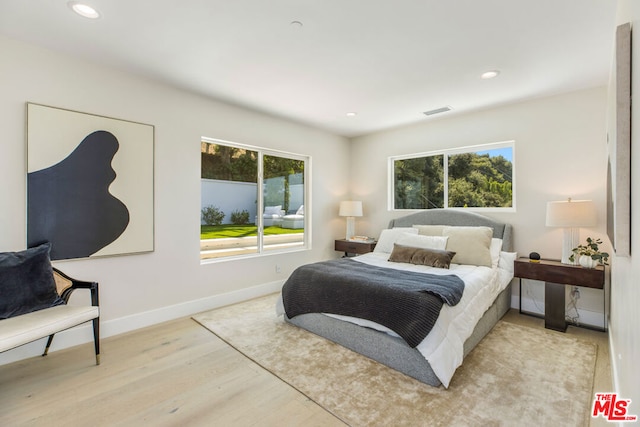 bedroom with light hardwood / wood-style floors