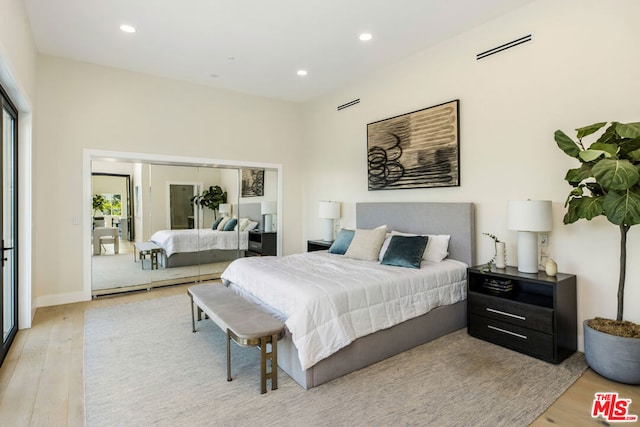 bedroom featuring light wood-type flooring