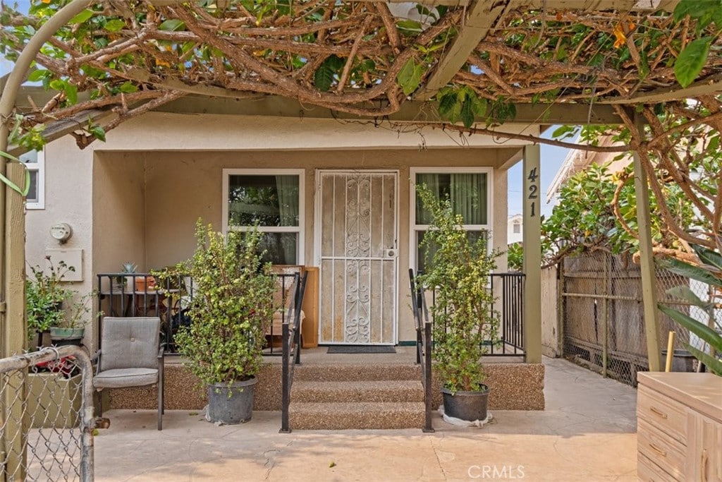 entrance to property with a patio