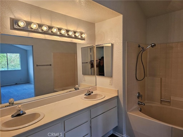 bathroom featuring vanity and washtub / shower combination