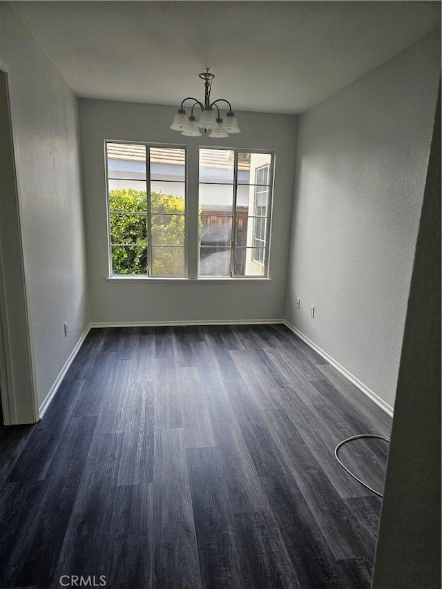 unfurnished dining area with a notable chandelier