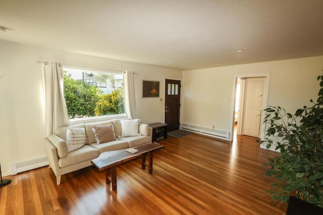 living room featuring a baseboard radiator and hardwood / wood-style floors