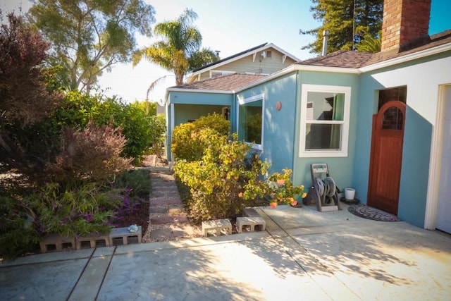 entrance to property with a patio