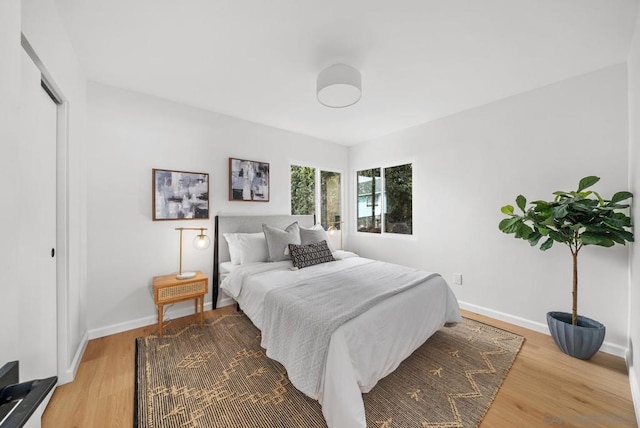 bedroom with light hardwood / wood-style flooring