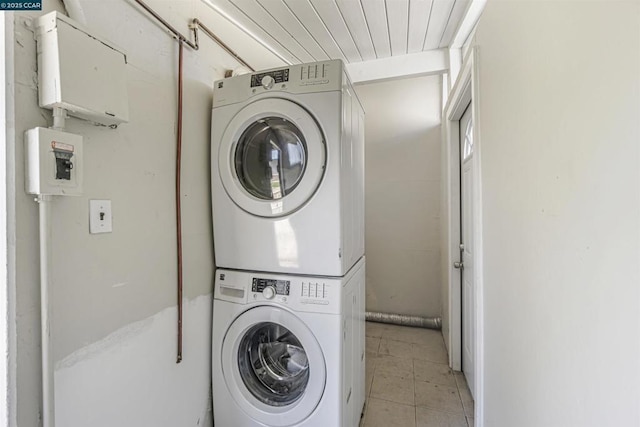 laundry area with stacked washer / drying machine