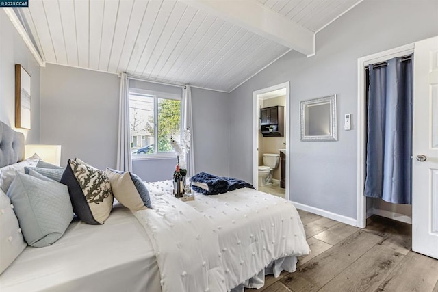 bedroom with ensuite bath, lofted ceiling with beams, wooden ceiling, and light wood-type flooring