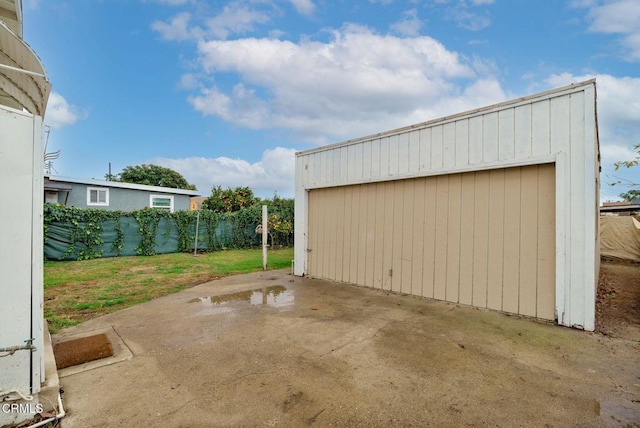 detached garage with fence