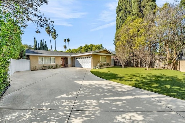 single story home with a garage and a front yard